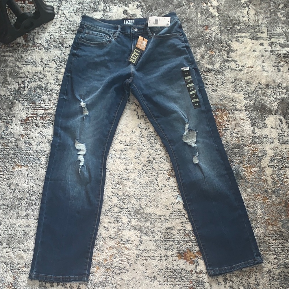 Blue Distressed Men's Jeans

Open to Offers!